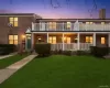 View of front of property featuring brick siding, a front lawn, and a porch View of front of property featuring brick siding, a front lawn, and a porch