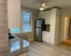 Recently renovated gorgeous upscale kitchen featuring white shaker cabinets, granite counters, stainless steel refrigerator, gas range and dishwasher, a pretty subway tile backsplash and light vinyl/ wood-style floors, Recently renovated gorgeous upscale kitchen featuring white shaker cabinets, granite counters, stainless steel refrigerator, gas range and dishwasher, a pretty subway tile backsplash and light vinyl/ wood-style floors,