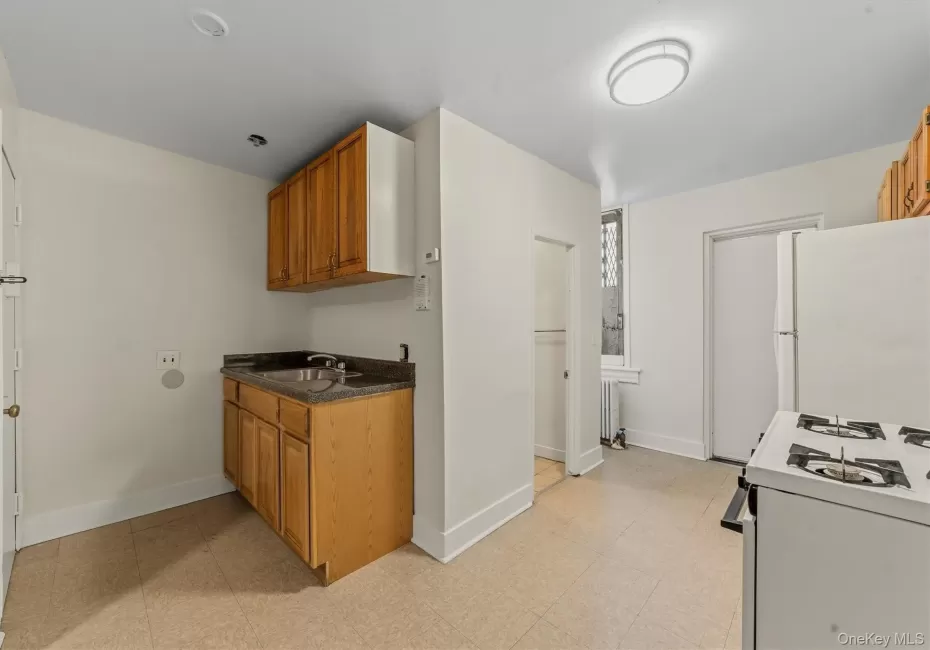 Eat in kitchn with view of bathroom and door to back fire escape. Eat in kitchn with view of bathroom and door to back fire escape.