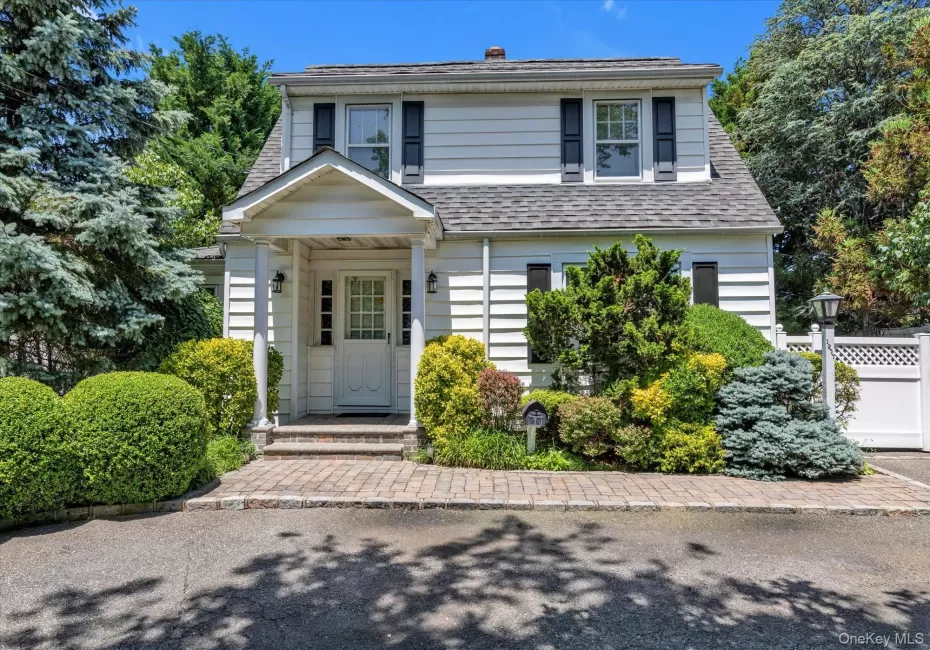 View of front of home featuring a shingled roof View of front of home featuring a shingled roof