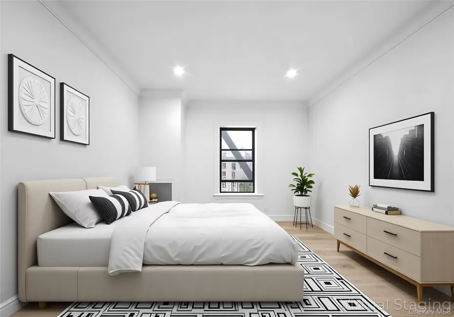 Bedroom featuring light wood-style floors, ornamental molding, and recessed lighting Bedroom featuring light wood-style floors, ornamental molding, and recessed lighting