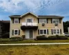 Front of structure showing sliding glass doors to patio and gardens. Front of structure showing sliding glass doors to patio and gardens.