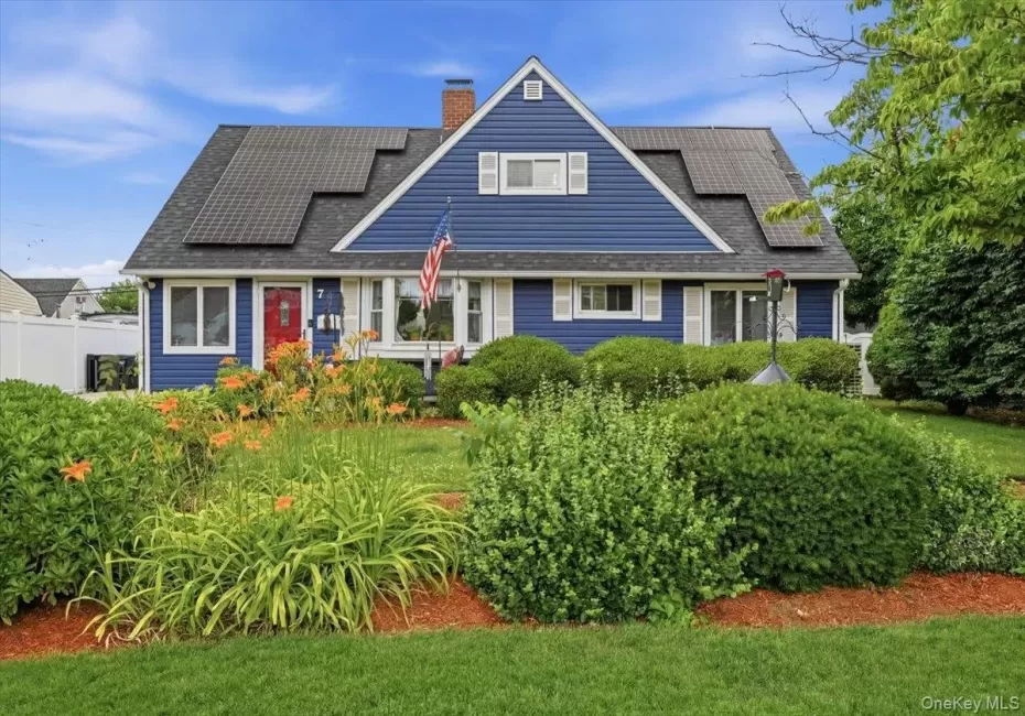 Blue siding exterior with white window trim and shutters Blue siding exterior with white window trim and shutters