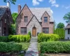 Impressive brick and stone Tudor with slate roof and elegant curb appeal Impressive brick and stone Tudor with slate roof and elegant curb appeal