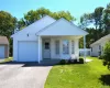 Front of home with porch and one car garage Front of home with porch and one car garage