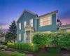 A beautiful twilight view highlights the home’s classic architecture, welcoming front entry, glowing windows, and mature landscaping. A beautiful twilight view highlights the home’s classic architecture, welcoming front entry, glowing windows, and mature landscaping.