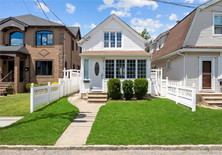White siding exterior featuring a covered entry porch White siding exterior featuring a covered entry porch