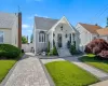 Charming residential exterior with stone facade accents and decorative outdoor lighting Charming residential exterior with stone facade accents and decorative outdoor lighting