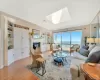 Living room. with wood burning fireplace, skylight, wood floors and amazing views of the Long Island Sound! Living room. with wood burning fireplace, skylight, wood floors and amazing views of the Long Island Sound!