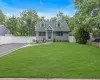 Craftsman style home with large front yard and driveway. Craftsman style home with large front yard and driveway.