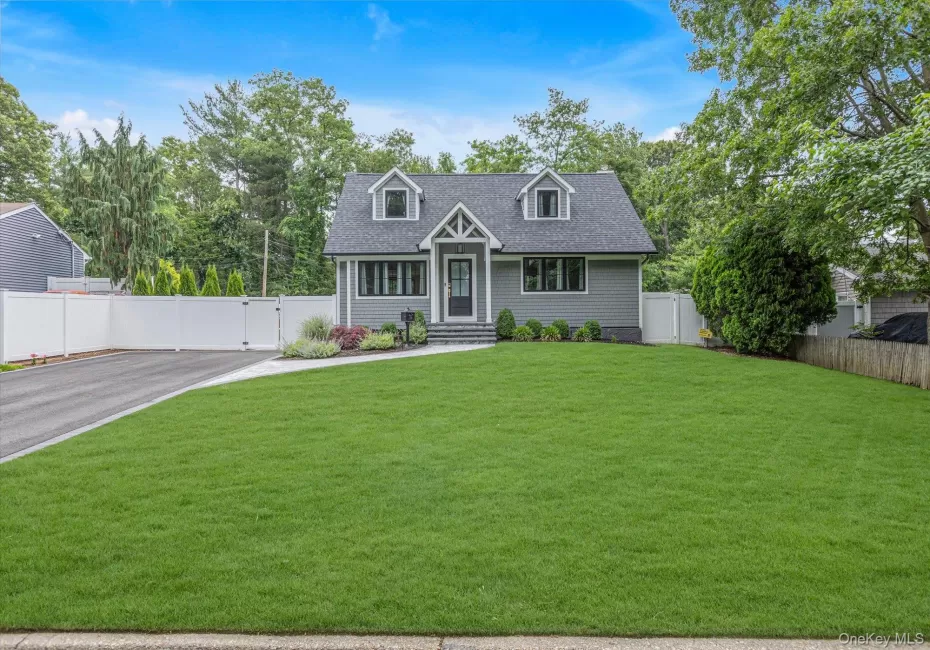 Craftsman style home with large front yard and driveway. Craftsman style home with large front yard and driveway.