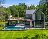 Stunning architecture with floor to ceiling windows, gunite pool and expansive terraces. Stunning architecture with floor to ceiling windows, gunite pool and expansive terraces.