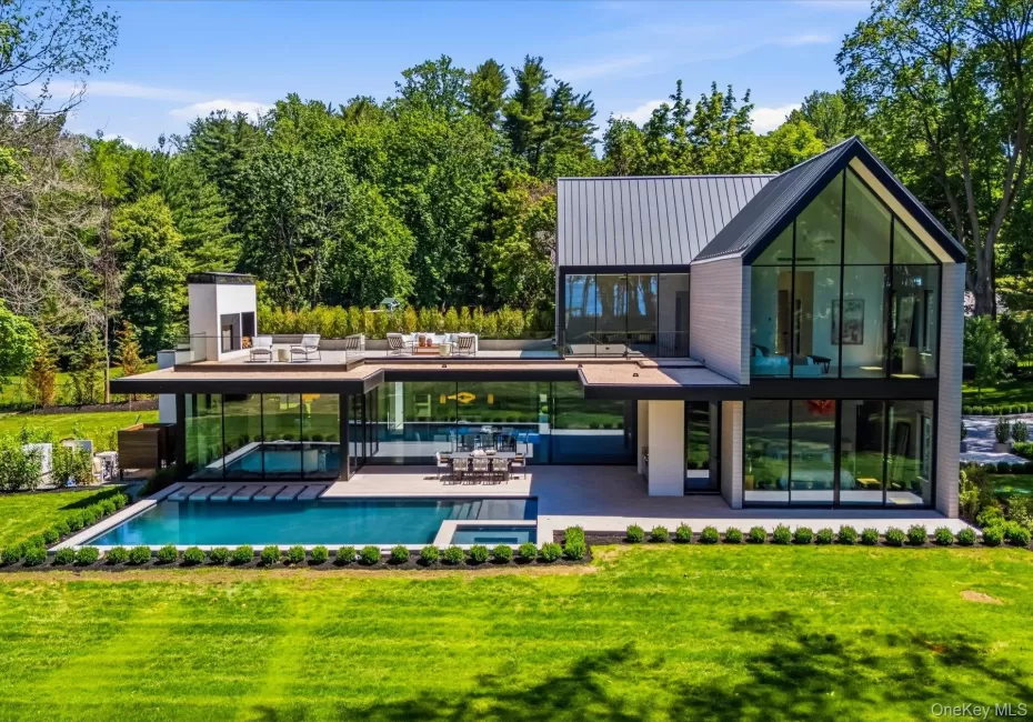 Stunning architecture with floor to ceiling windows, gunite pool and expansive terraces. Stunning architecture with floor to ceiling windows, gunite pool and expansive terraces.