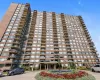 High-rise building featuring a brick facade and numerous private balconies High-rise building featuring a brick facade and numerous private balconies