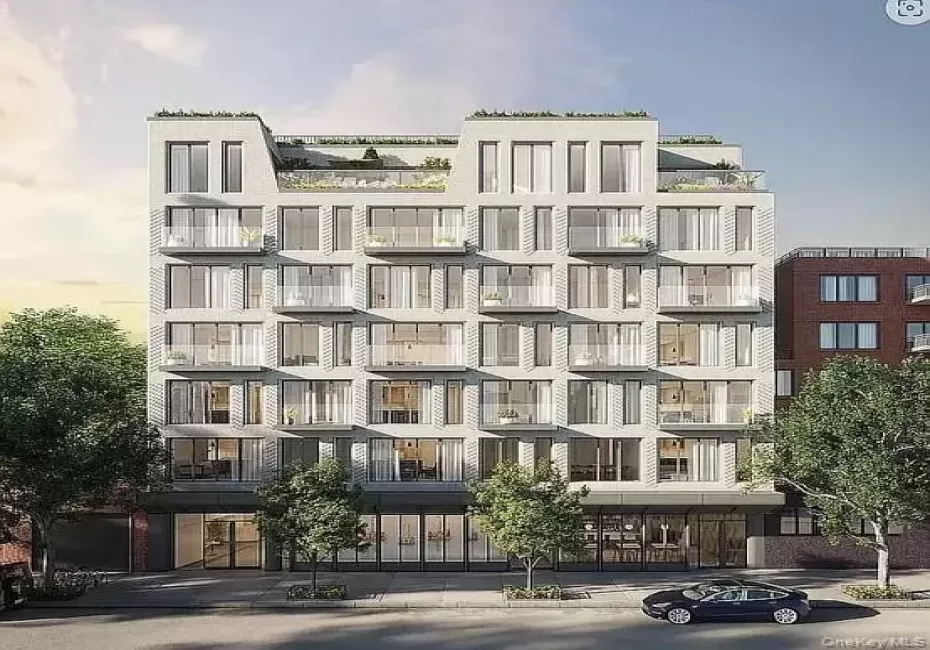 Contemporary multi-story building featuring a light-colored facade with numerous windows and private balconies Contemporary multi-story building featuring a light-colored facade with numerous windows and private balconies