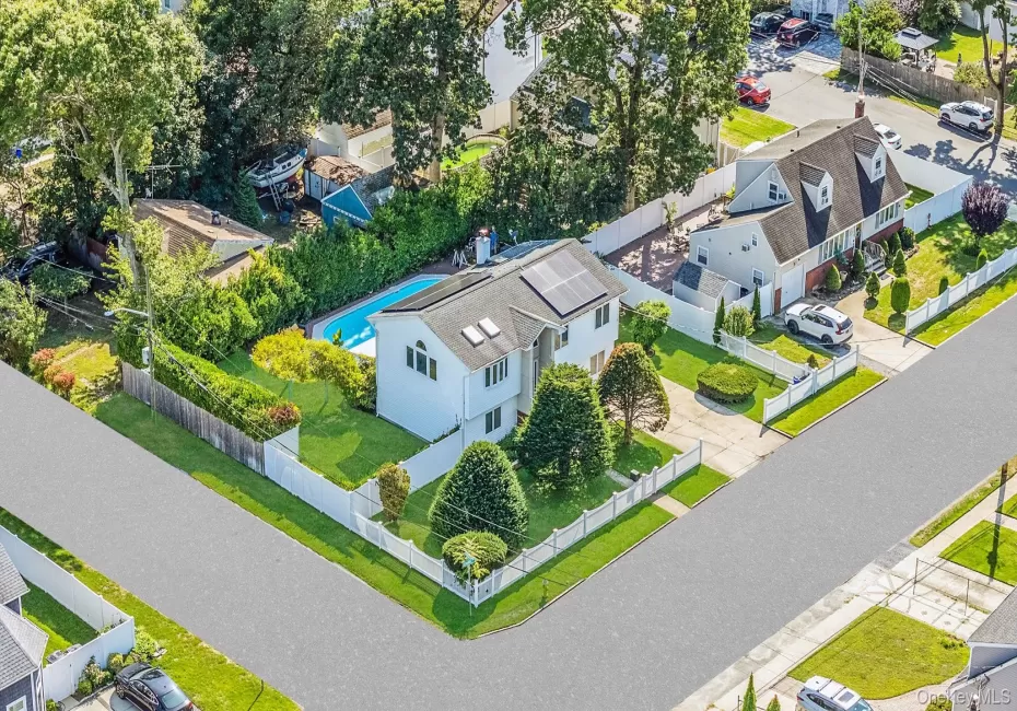 Aerial view of residential area featuring a pool Aerial view of residential area featuring a pool