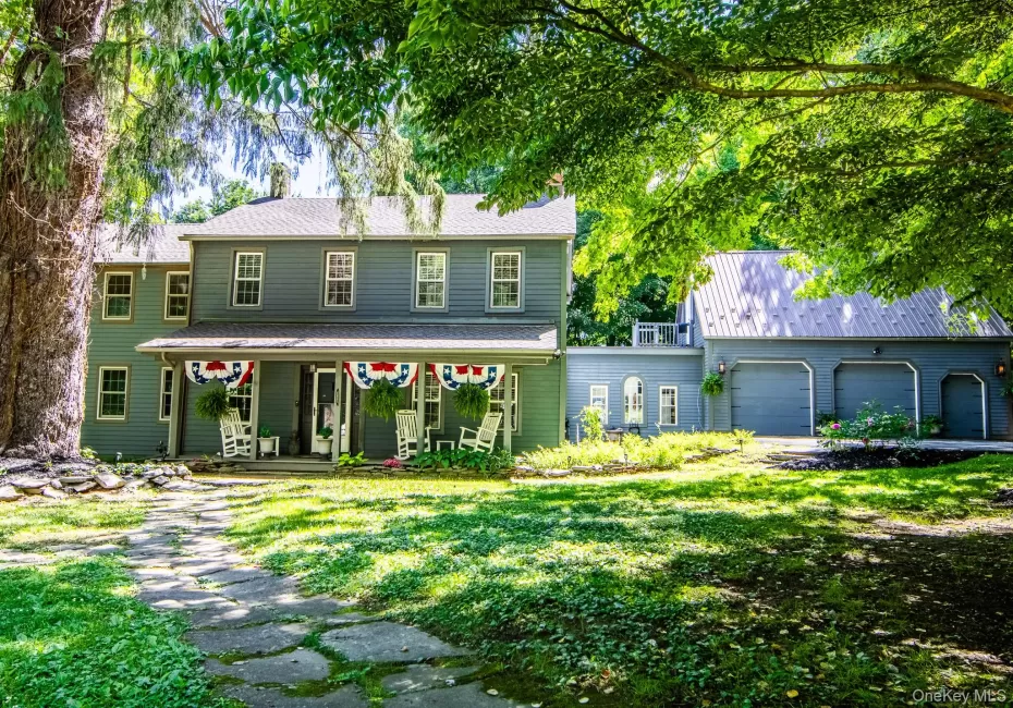 Traditional Colonial Style home has a rocking chair porch and attached 3 car garage Traditional Colonial Style home has a rocking chair porch and attached 3 car garage