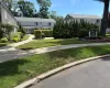 Beautifully landscaped entrance with common area courtyard: table and chairs for your BBQ use. Desirable street level location. Beautifully landscaped entrance with common area courtyard: table and chairs for your BBQ use. Desirable street level location.
