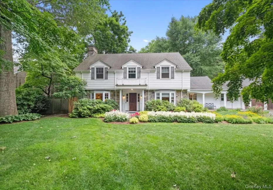 Gorgeous colonial-style home featuring stone and siding facade Gorgeous colonial-style home featuring stone and siding facade