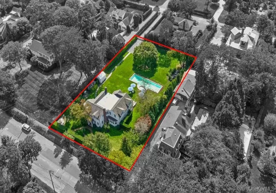 Aerial view of residential area featuring property boundaries highlighted Aerial view of residential area featuring property boundaries highlighted