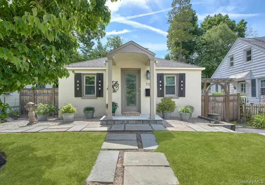 Front of house with gate and Pagoda to fenced in back yard Front of house with gate and Pagoda to fenced in back yard