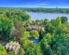 View of property location with a heavily wooded area and a nearby body of water View of property location with a heavily wooded area and a nearby body of water