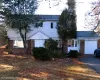 View of front of house featuring brick siding, an attached garage, and driveway View of front of house featuring brick siding, an attached garage, and driveway