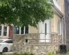 View of home's exterior featuring stone siding View of home's exterior featuring stone siding
