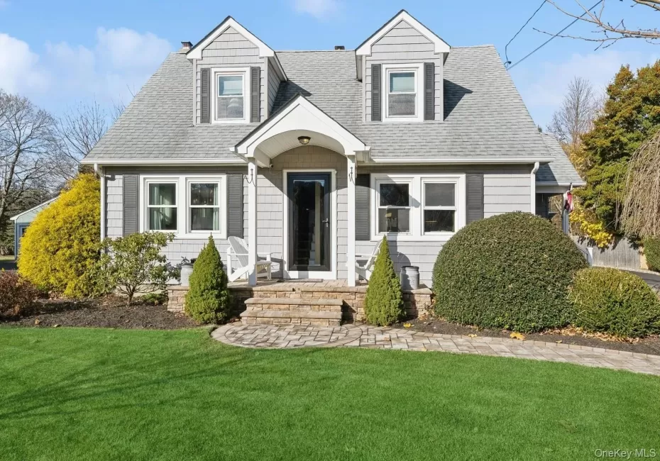 Cape cod home with a front lawn Cape cod home with a front lawn