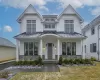 View of front of home featuring stone siding, a standing seam roof, covered porch, and metal roof View of front of home featuring stone siding, a standing seam roof, covered porch, and metal roof