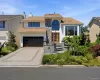 Contemporary residence featuring a stone facade and white siding Contemporary residence featuring a stone facade and white siding