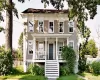 View of front facade featuring covered porch and stairway View of front facade featuring covered porch and stairway