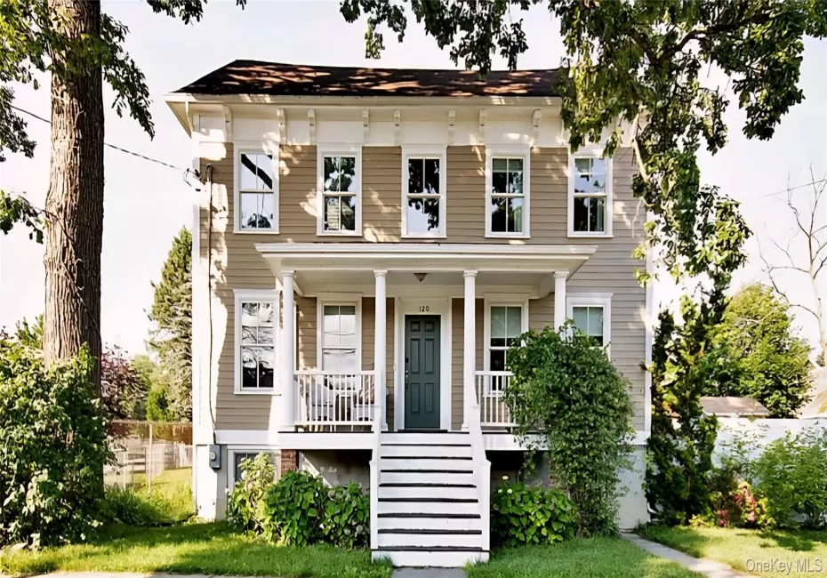 View of front facade featuring covered porch and stairway View of front facade featuring covered porch and stairway