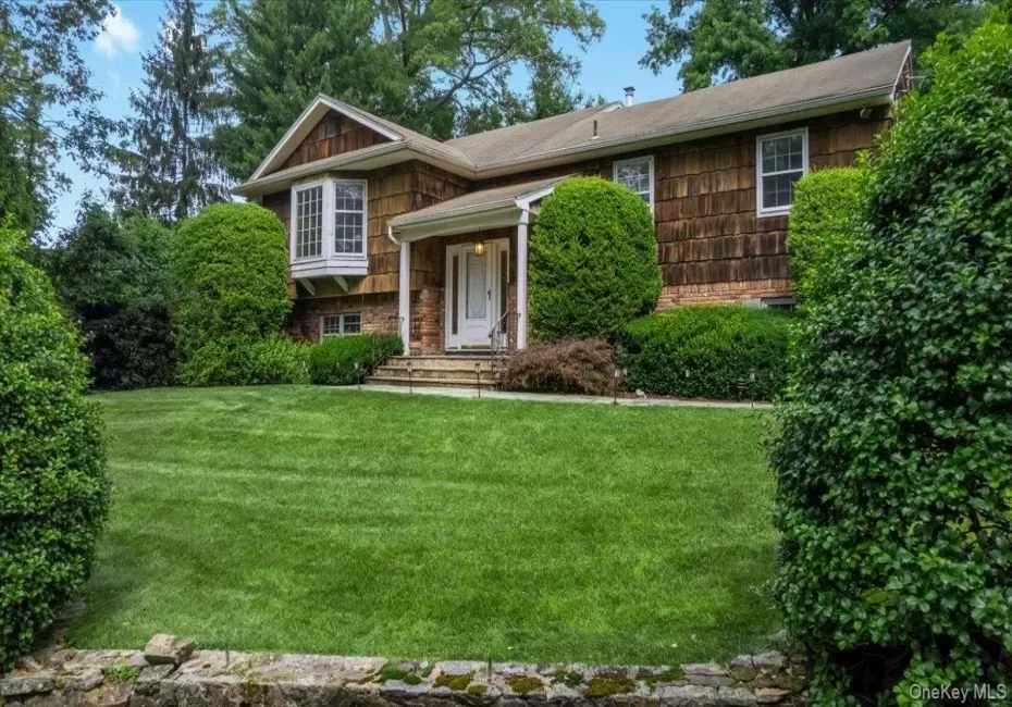 35 Pinehurst sits proudly with lush lawn and landscaping accented by stone walls lining the driveway as you approach the house. 35 Pinehurst sits proudly with lush lawn and landscaping accented by stone walls lining the driveway as you approach the house.