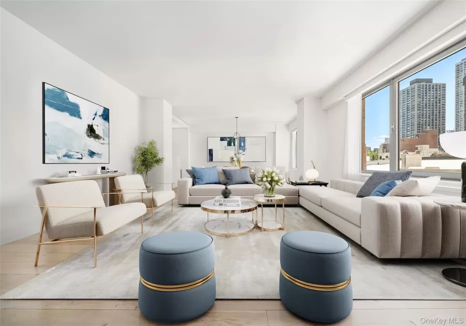 Spacious living area featuring expansive windows, wood-finish flooring, and white walls Spacious living area featuring expansive windows, wood-finish flooring, and white walls