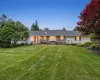 A warm twilight view of 5 Hedges Road, a beautifully maintained Warwick ranch where pride of ownership is evident from the moment you arrive. A warm twilight view of 5 Hedges Road, a beautifully maintained Warwick ranch where pride of ownership is evident from the moment you arrive.