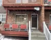 Doorway to property featuring brick siding Doorway to property featuring brick siding