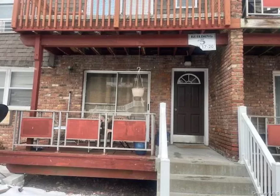 Doorway to property featuring brick siding Doorway to property featuring brick siding