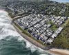 View of property location with expansive beach and nearby suburban area View of property location with expansive beach and nearby suburban area