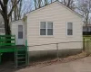 View of side of duplex home featuring a gate and a deck AI modified View of side of duplex home featuring a gate and a deck AI modified