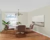 STAGED: Dining space featuring a chandelier and light wood-style floors STAGED: Dining space featuring a chandelier and light wood-style floors