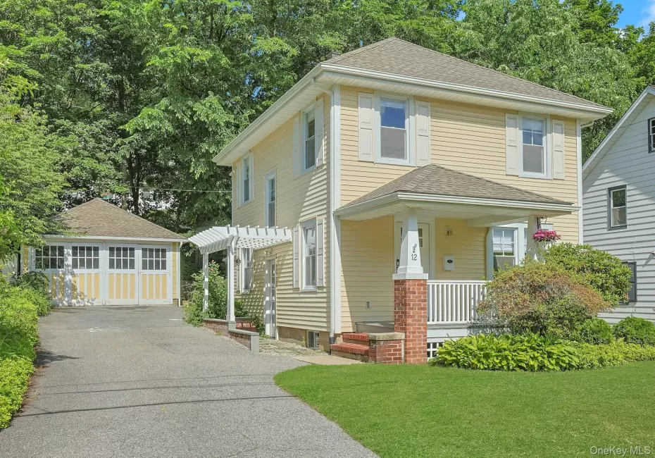 Covered front porch, side entry with pergola and 2 car detached garage. Covered front porch, side entry with pergola and 2 car detached garage.