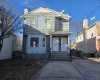 View of front of house featuring a chimney and fence View of front of house featuring a chimney and fence