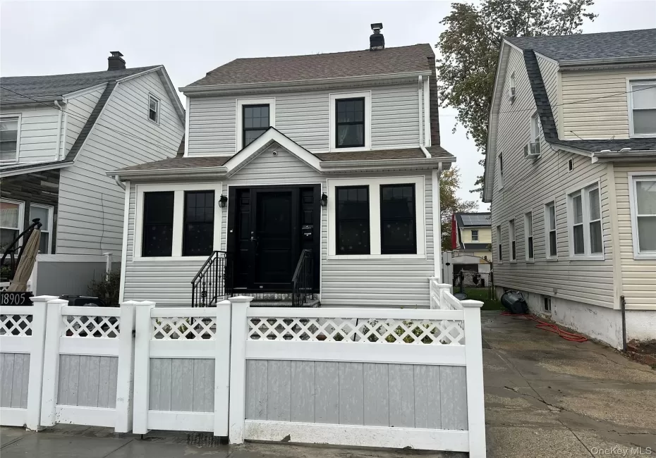 View of front of property featuring a fenced front yard, a chimney, roof with shingles, and a gate View of front of property featuring a fenced front yard, a chimney, roof with shingles, and a gate