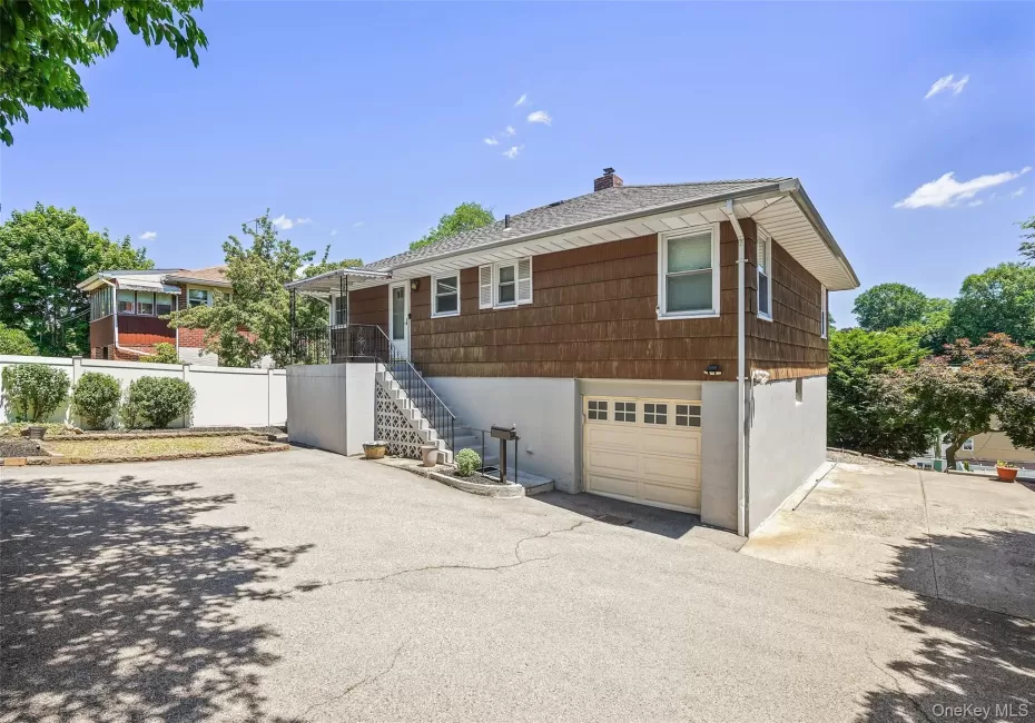 Exterior view from driveway with ample room for parking. Exterior view from driveway with ample room for parking.