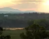 View of mountain feature featuring a water view and a wooded view View of mountain feature featuring a water view and a wooded view