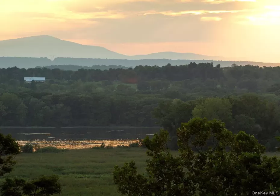 View of mountain feature featuring a water view and a wooded view View of mountain feature featuring a water view and a wooded view
