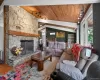 Stone fireplace with a substantial timber mantel Stone fireplace with a substantial timber mantel