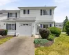 White vinyl siding exterior with dark blue shutters White vinyl siding exterior with dark blue shutters