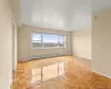 Unfurnished room featuring a baseboard radiator and baseboards Unfurnished room featuring a baseboard radiator and baseboards